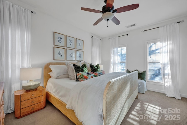 bedroom with light carpet and ceiling fan