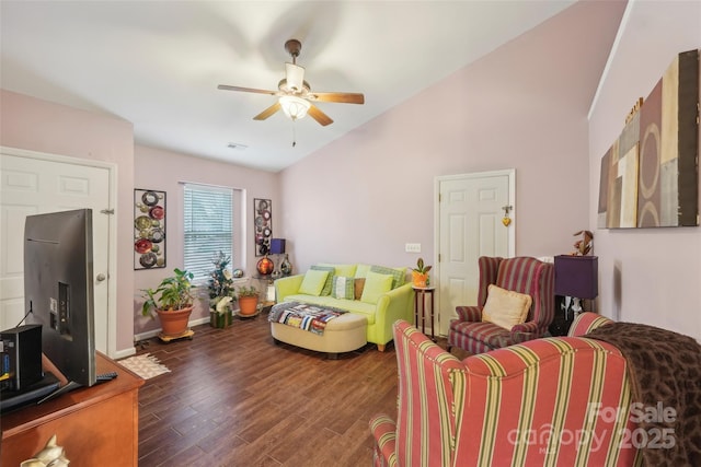 living room featuring dark hardwood / wood-style flooring, ceiling fan, and lofted ceiling