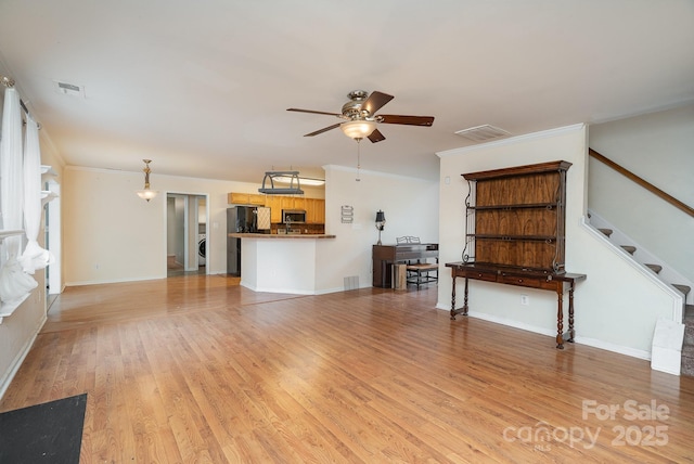 unfurnished living room with ornamental molding, ceiling fan, and light hardwood / wood-style flooring