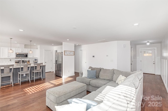 living room featuring dark hardwood / wood-style floors