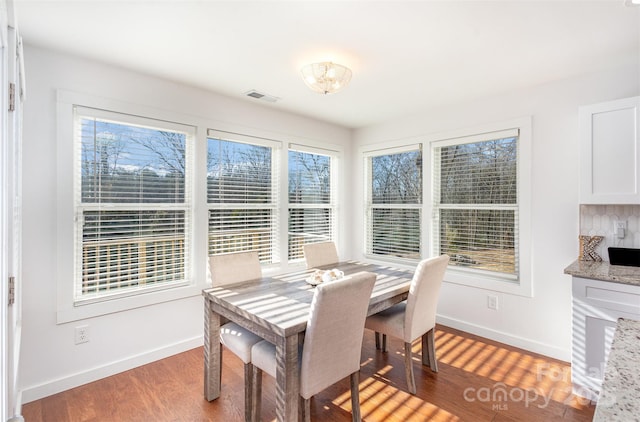 dining room with wood-type flooring