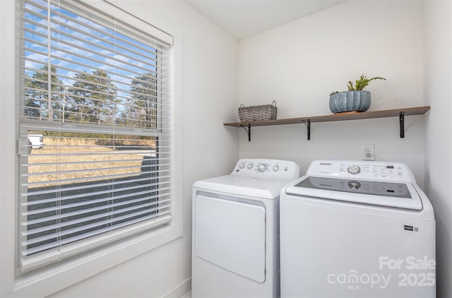 clothes washing area with washing machine and clothes dryer