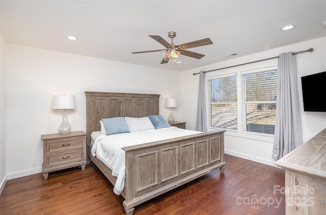 bedroom with ceiling fan and dark hardwood / wood-style flooring