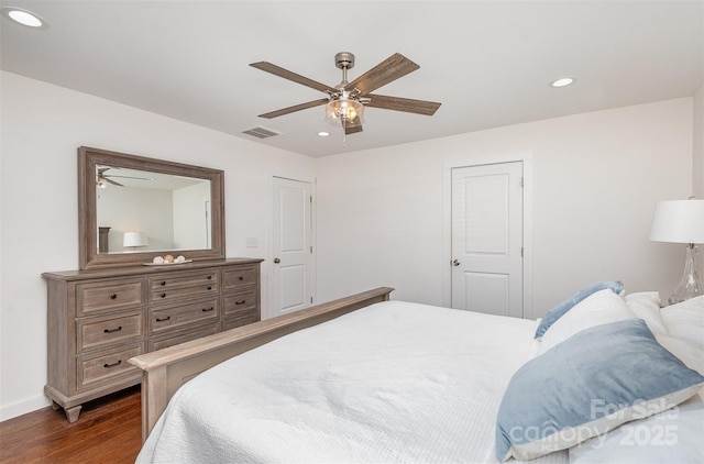 bedroom featuring ceiling fan and dark hardwood / wood-style floors