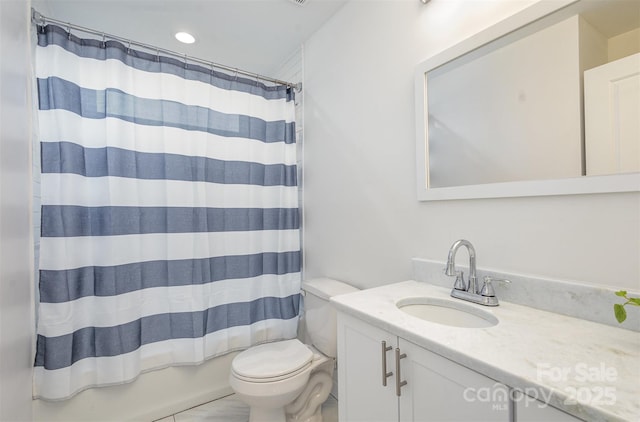 full bathroom with shower / bath combo with shower curtain, toilet, and vanity