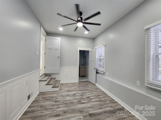 corridor featuring light hardwood / wood-style flooring