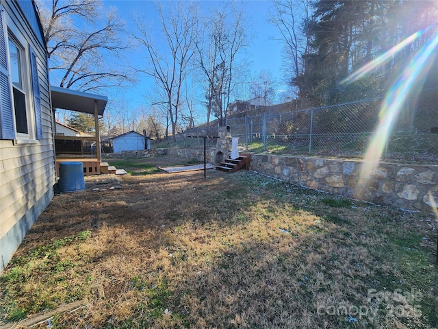 view of yard with a wooden deck