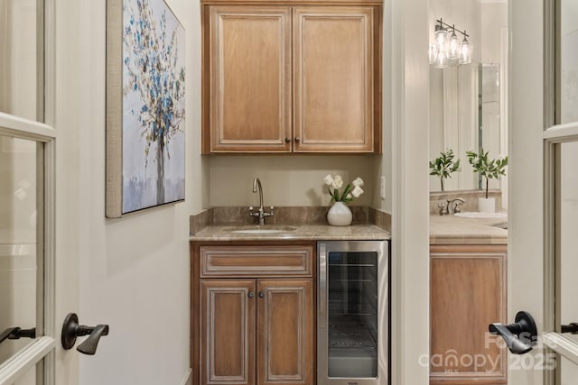 bar featuring sink and beverage cooler