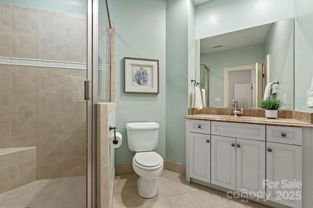 bathroom featuring vanity, toilet, walk in shower, and tile patterned floors