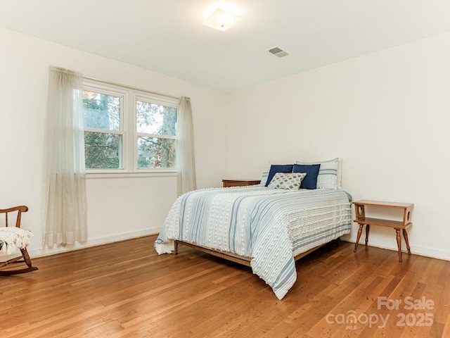 bedroom featuring hardwood / wood-style flooring