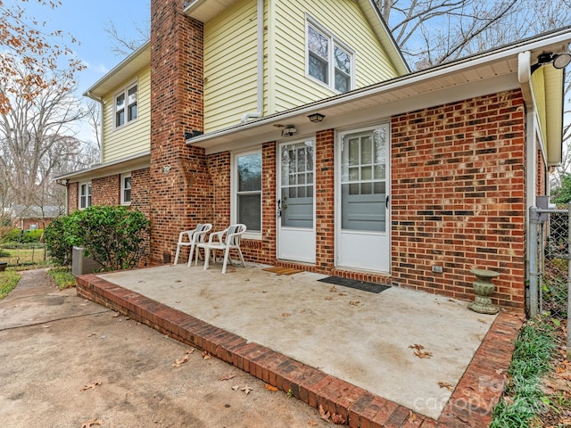 rear view of property featuring a patio