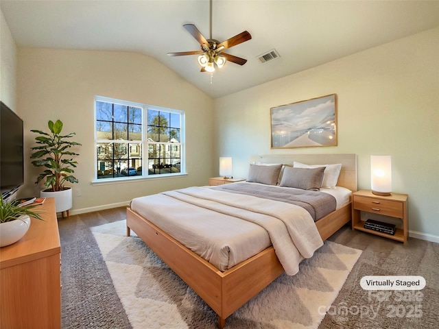 bedroom with carpet flooring, ceiling fan, and vaulted ceiling