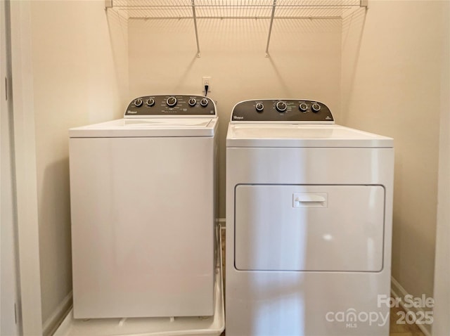 washroom with washing machine and dryer