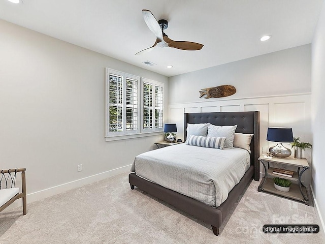 carpeted bedroom with ceiling fan