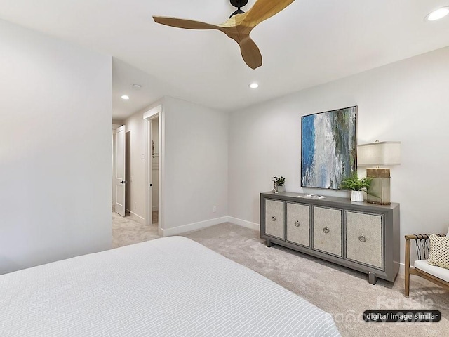 bedroom with ceiling fan and light colored carpet