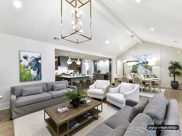 living room with lofted ceiling with beams, a notable chandelier, and light wood-type flooring