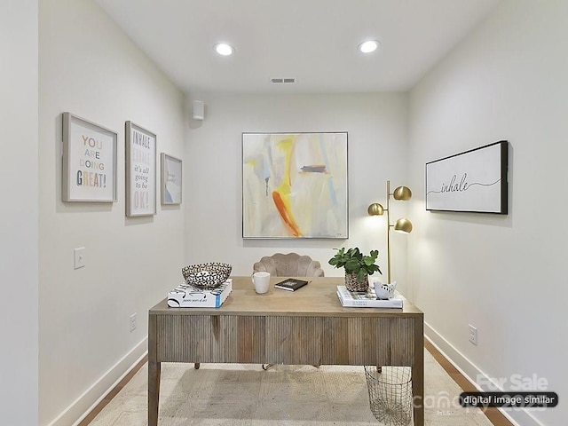 office area with light hardwood / wood-style flooring