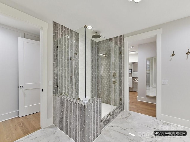 bathroom with tiled shower