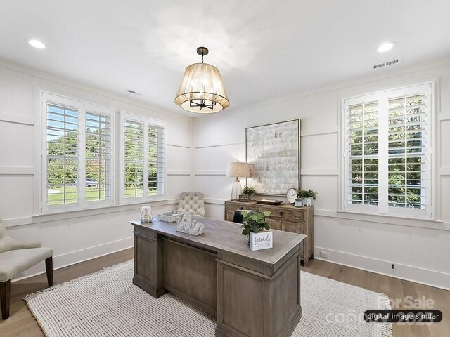 office area featuring wood finished floors, baseboards, a chandelier, recessed lighting, and crown molding