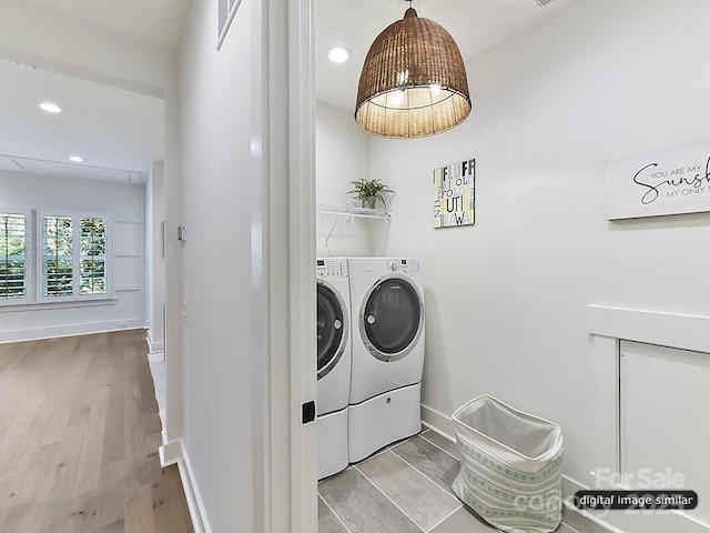 washroom featuring washer and dryer, baseboards, recessed lighting, and light wood finished floors