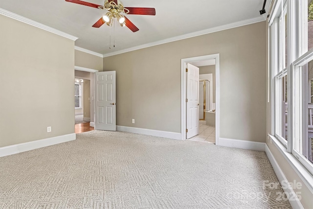 unfurnished bedroom with connected bathroom, ceiling fan, crown molding, and light carpet