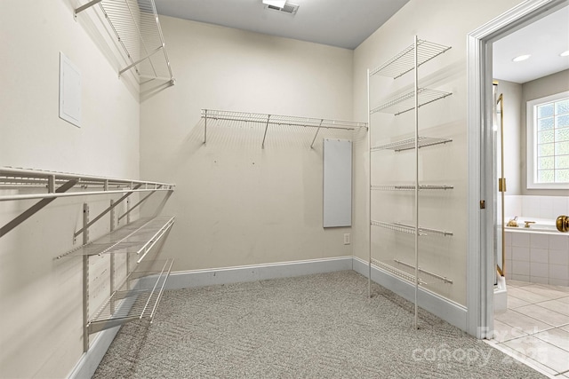 spacious closet featuring tile patterned floors