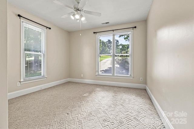 spare room with ceiling fan