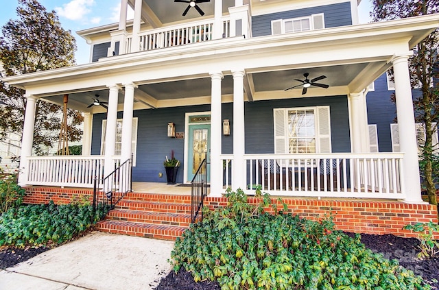 entrance to property featuring ceiling fan, a porch, and a balcony