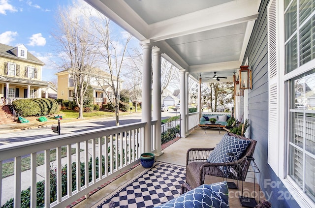 balcony with ceiling fan and covered porch