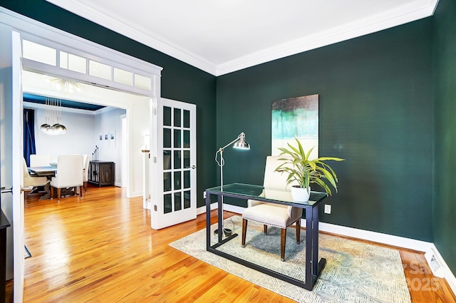 office with hardwood / wood-style floors and ornamental molding