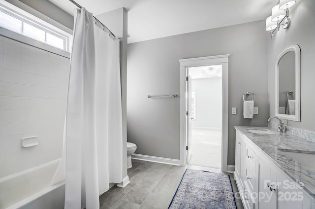 full bathroom featuring vanity, shower / bath combo, and toilet