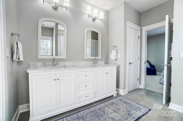 bathroom featuring tile patterned flooring and vanity