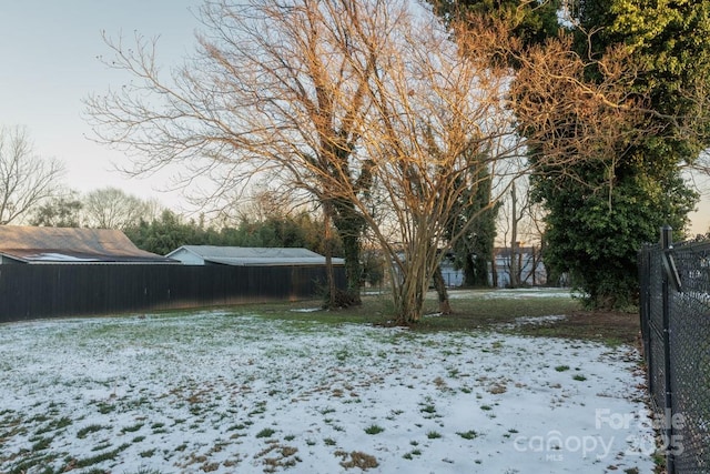 view of yard layered in snow