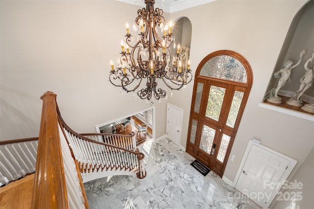 entrance foyer with french doors and a high ceiling