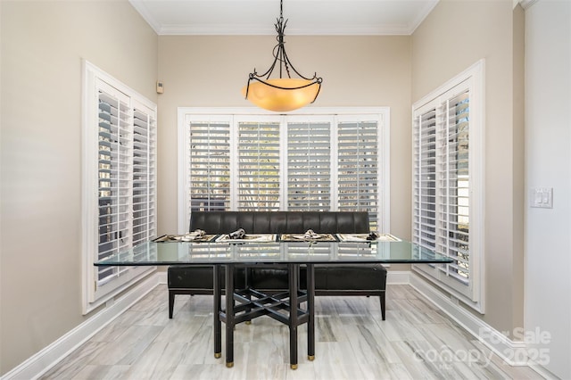 dining space featuring ornamental molding