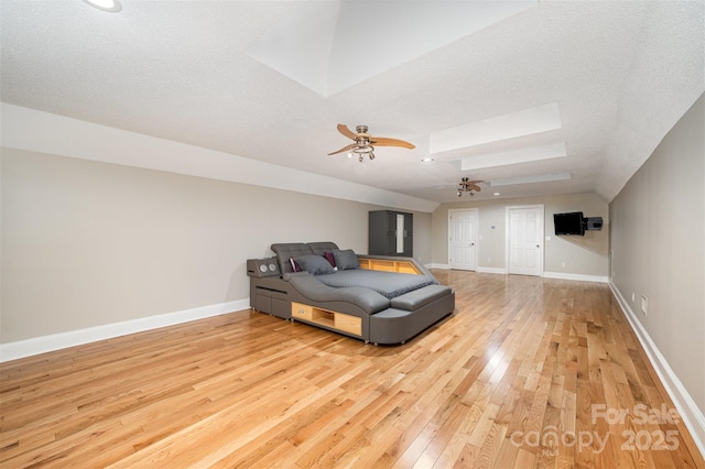 bedroom featuring a textured ceiling, ceiling fan, and light hardwood / wood-style flooring