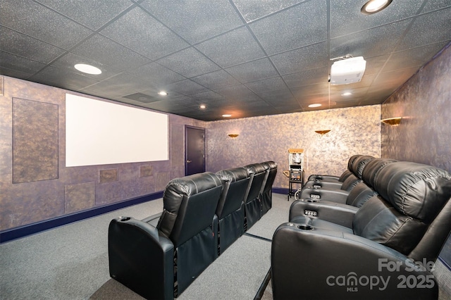 home theater with carpet floors and a paneled ceiling