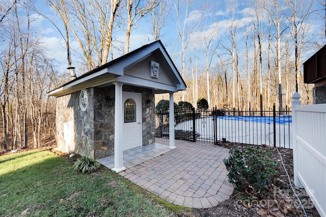 view of outbuilding featuring a covered pool