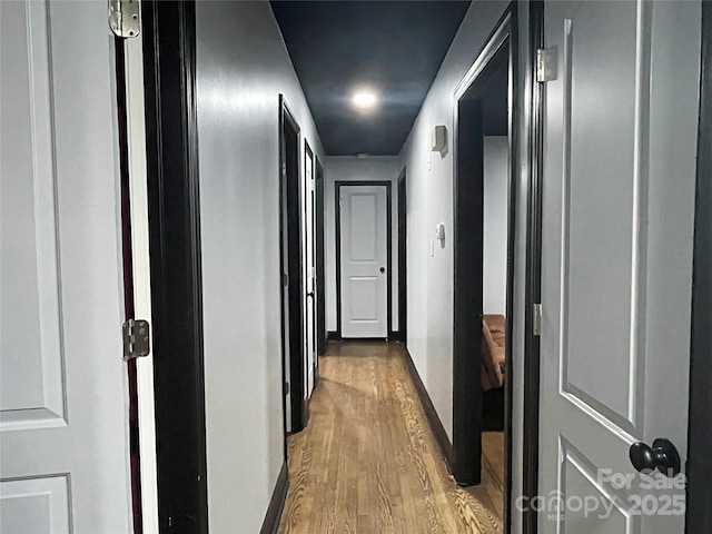 corridor featuring hardwood / wood-style flooring