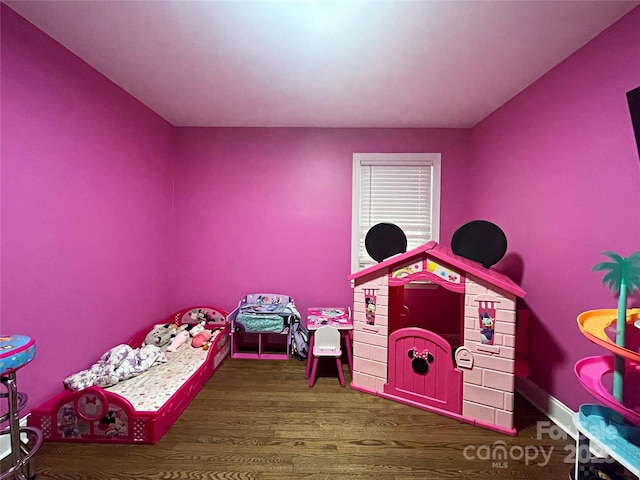 bedroom featuring dark hardwood / wood-style floors