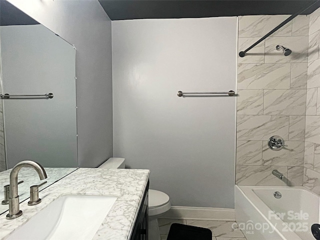 full bathroom with vanity, toilet, and tiled shower / bath