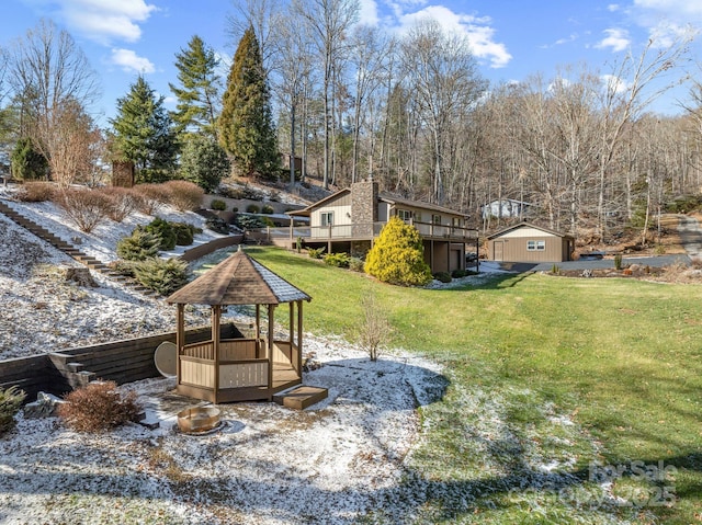 view of yard featuring a gazebo and a wooden deck