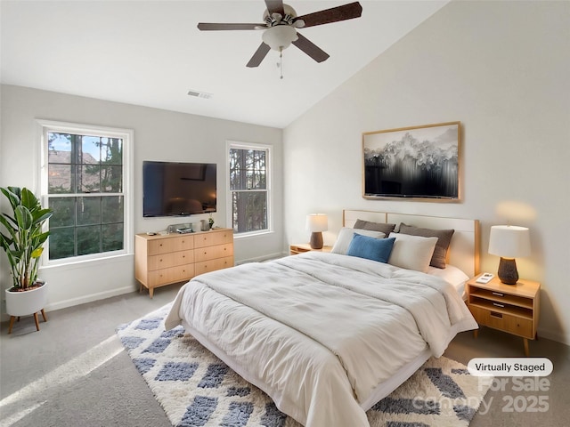 bedroom with ceiling fan, carpet floors, and lofted ceiling