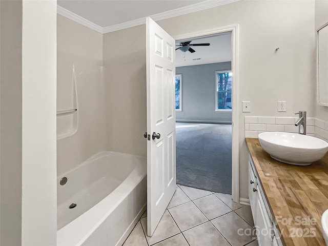 bathroom featuring tile patterned floors, ceiling fan, vanity, and ornamental molding