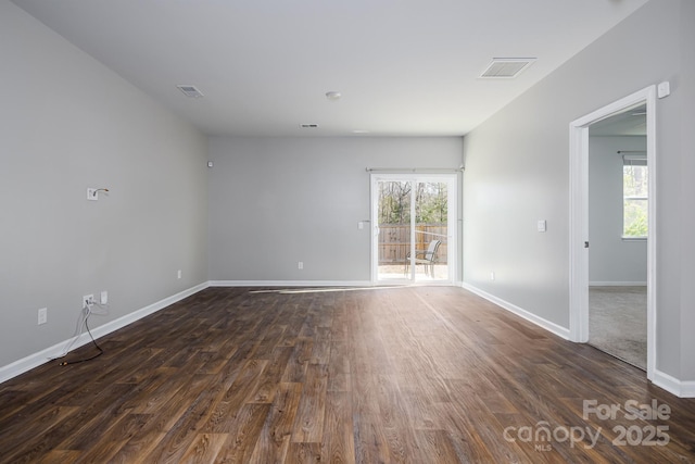 unfurnished room featuring dark wood-type flooring