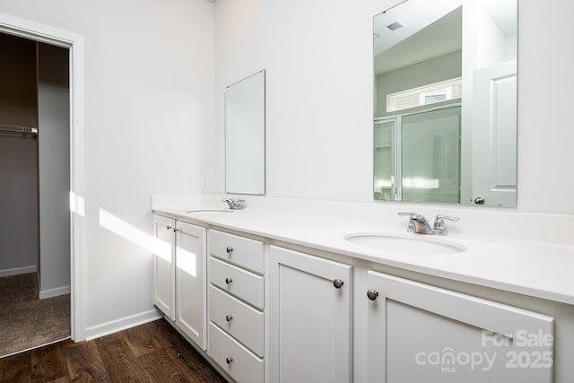 bathroom featuring hardwood / wood-style floors and vanity