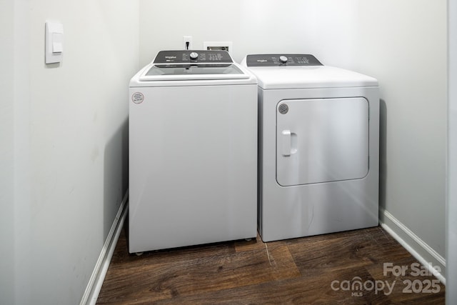 laundry room featuring dark wood-type flooring and washer and dryer