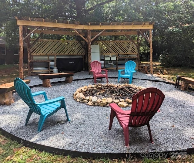 view of patio with a fire pit