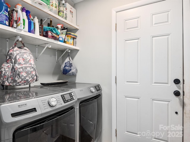 clothes washing area featuring laundry area and separate washer and dryer