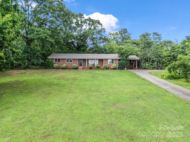 1737 Whitesides Rd, Forest City, NC 28043 - single story home featuring asphalt driveway, a front yard, and a detached carport